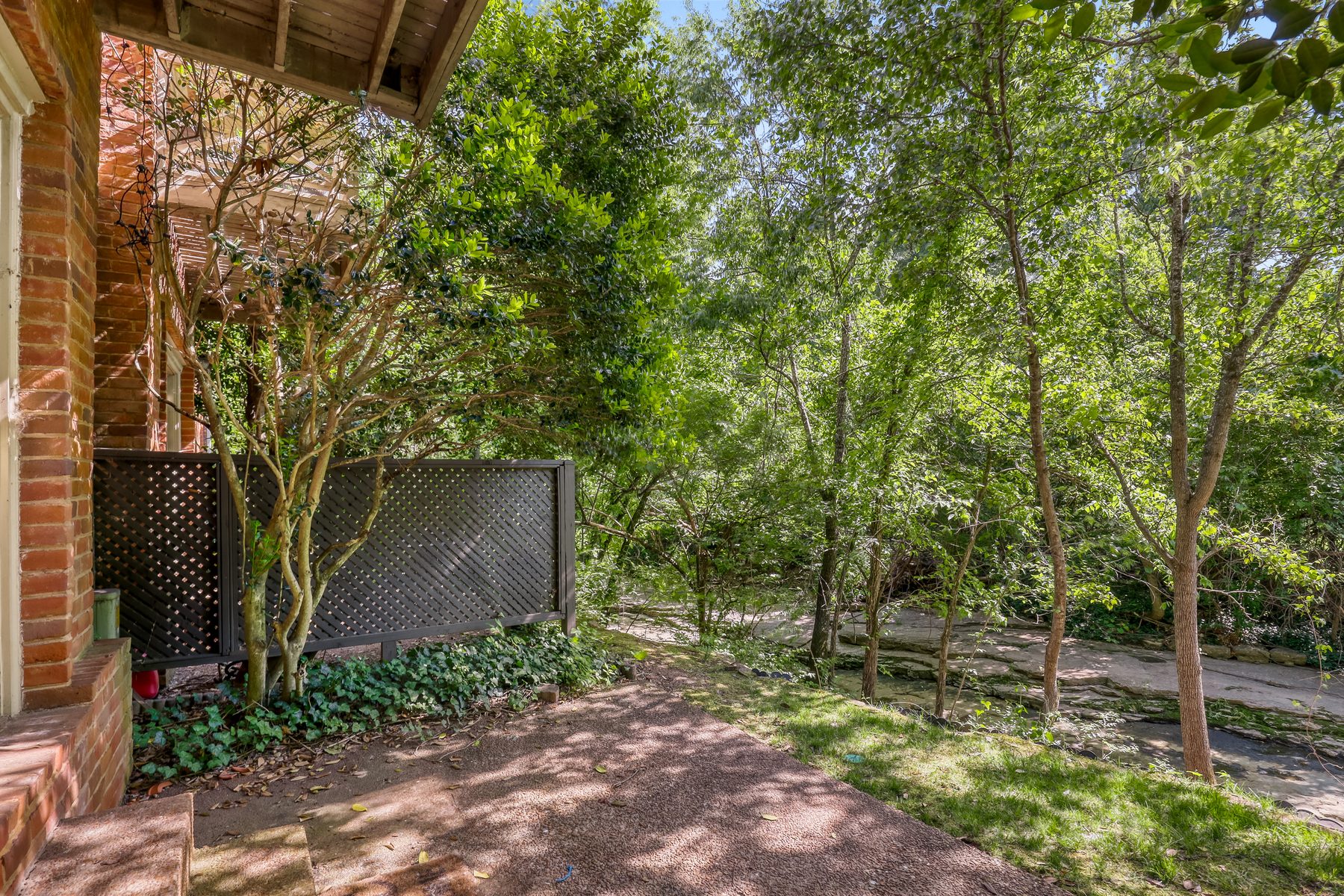 Private rear patio overlooking wooded creek